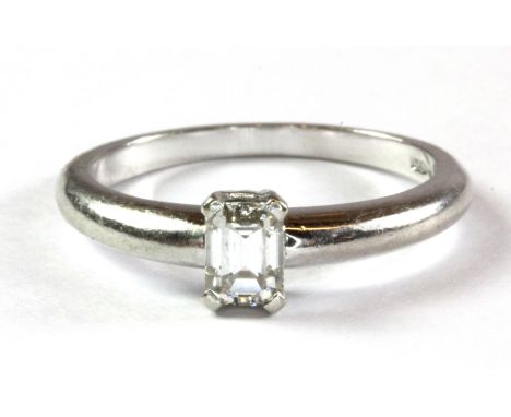 A platinum and baguette cut diamond solitaire (approx. 0.25ct) ring (M) Approx. 4.3 g.