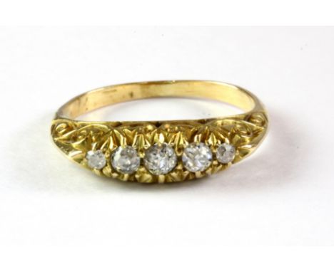 An antique yellow metal (tested 18ct gold) ring set with five diamonds. (M)