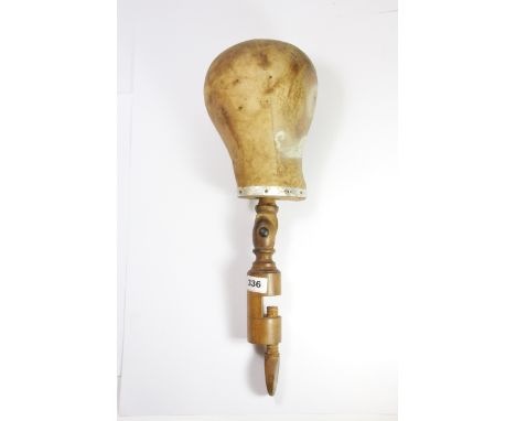 A table mounted vintage milliners head, H. 52cm.