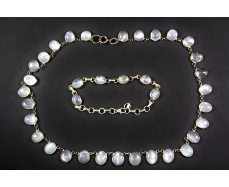 A vintage sterling silver and moonstone necklace with a similar bracelet.