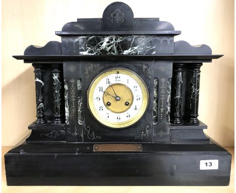 An early 20th century French slate and marble mantle clock, W. 48cm H. 39cms.
