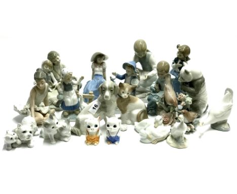 A collection of Nao, Lladro and similar figures.