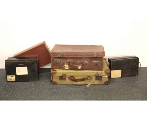Three vintage suitcases and two deed boxes.