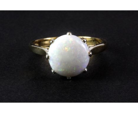 A 9ct yellow gold ring set with a large (2ct) opal. (P)