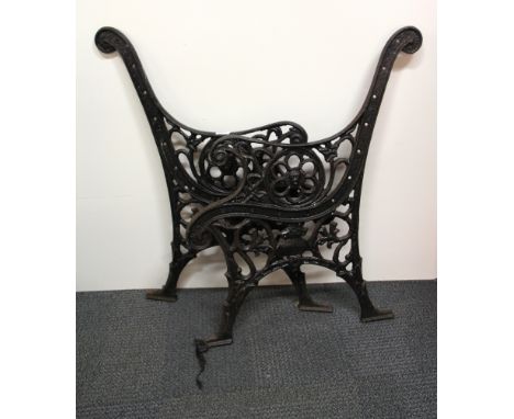 A pair of old cast iron bench ends.