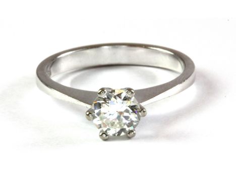 An 18ct white gold ring (stamped 750) set with a solitaire diamond (approx. 0.64ct). (M)