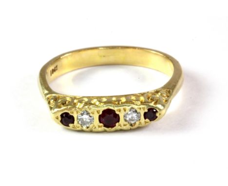 A heavy 18ct yellow gold stamped 18ct) ring set with rubies and diamonds. ( R ) Approx. 5.3g.