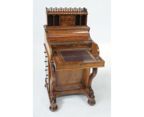 A fine walnut piano top mechanical Davenport
The rectangular top with a pierced three quarter gallery with a lever operating 