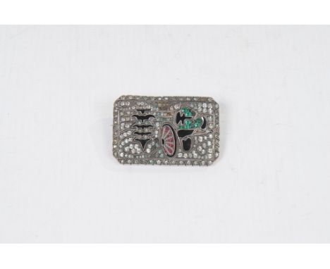 An Art Deco American silver, paste set plaque brooch
Of canted rectangular form set with white and green paste stones, with b