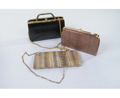 Three reptile skin handbags, circa 1980
To include a light brown snakeskin clutch, with suede lined interior, a tri-colour sn