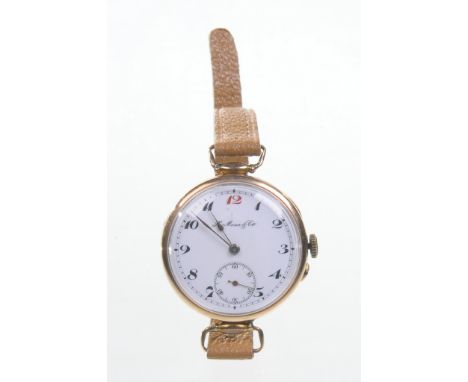 An early 20th Century gentleman's 9ct gold cased wristwatch, by H Moser & Co
The white enamel Arabic dial with outer minute t