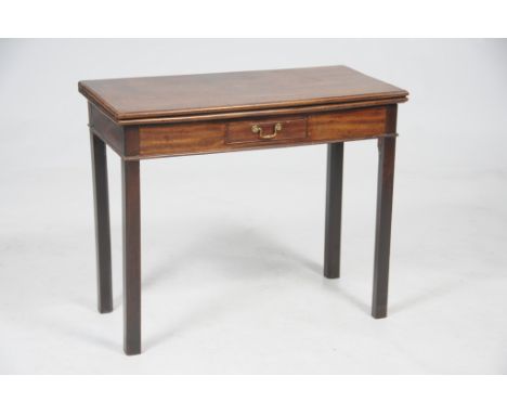 A George III mahogany tea table
The rectangular moulded hinged top above a frieze drawer raised upon shaped square section le