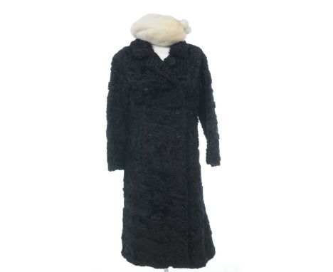 A fine quality black Persian lamb fur coat, circa 1960's
Three-quarter length, double breasted with feature button detailing,