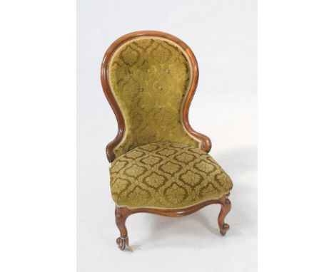 A Victorian rosewood drawing room chair 
The curvilinear waisted button back green leafy tapestry serpentine seat raised upon