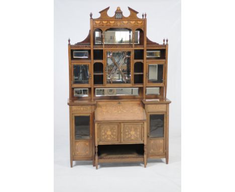 A Choice Edwardian inlaid rosewood and mahogany bureau cabinet circa 1900
In the manner of of Edwards and Roberts, with an ar