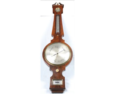 A George IV mahogany wheel barometer
With a 25cm silvered register signed R Adie, Liverpool above a hygrometer, thermometer a