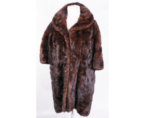 A Kendal Milne, Manchester chocolate brown mink coat, circa 1960's
Three-quarter length with triple detail button fastening t