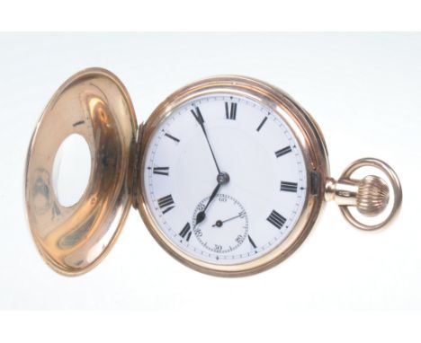 A 9ct gold gentlemans half Hunter pocket watch
Manual wind, having white Roman dial with outer minute track and subsidiary se