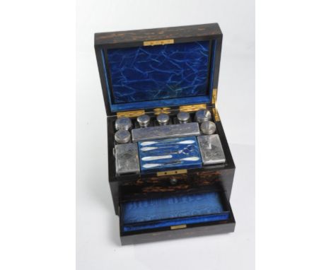 A fine 19th Century calamander ladies vanity case
The rectangular hinged cover centred with a brass oval with a blue silk pad