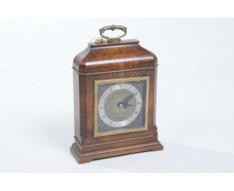 An Elliott walnut cased mantel clock
With a 9cm silvered dial, by Boodle & Dunthorne, Liverpool the spring driven movement co