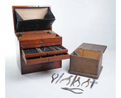 A late 19th Century mahogany dentist table chest of drawers
The rectangular hinged cover with a brass handle and a plaque JKH