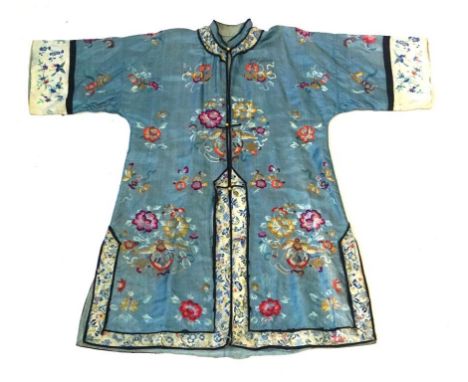 A Chinese embroidered tunic robe, early 20th Century
The pale blue sating robe with high button collar and black satin trim, 