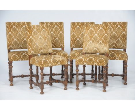 A set of six walnut and upholstered dining chairs
Each with gilt leaf and flower and tapestry backs and stuff over seats rais