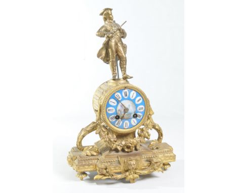 A 19th Century French gilt spelter and porcelain figural mantel clock
With a 8cm porcelain dial with Roman numerals painted w