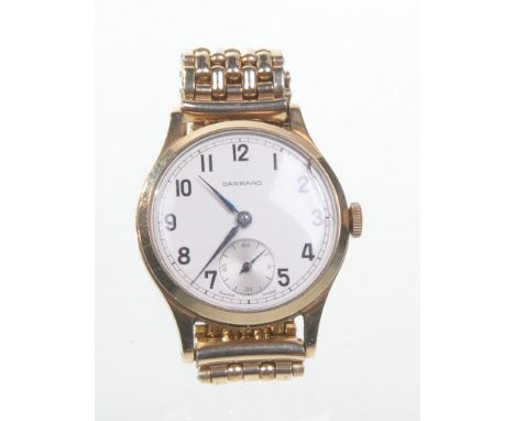 Garrard: A gentleman's 9ct gold cased manual wind wristwatch
The champagne Arabic dial with outer minute track and subsidiary