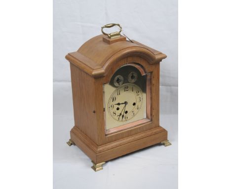 A oak bracket clock, 20th Century
With a 15cm brass dial with subsidiary chime silent and slow fast dials in the arch the thr