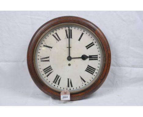 An oak cased dial clock
With a 29cm white dial with Roman numerals, indistinctly signed BR, possibly  for British Railways, t