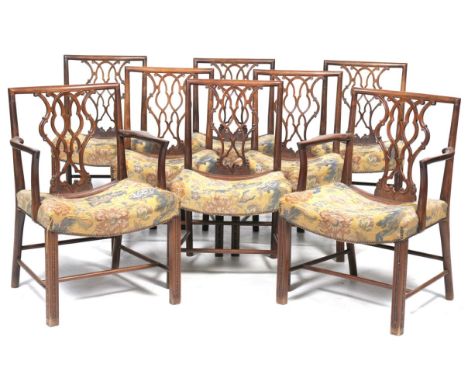 A Fine set of eight George III style mahogany dining chairs
With shaped cresting rails above interlaced 'C' scroll vase shape