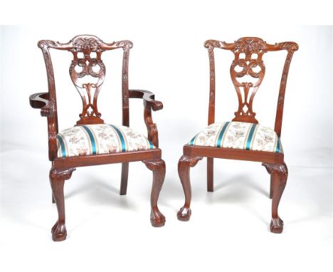 An attractive set of eight mahogany Chippendale style dining chairs, 20th Century
Each with "C" scroll and leafy cresting abo