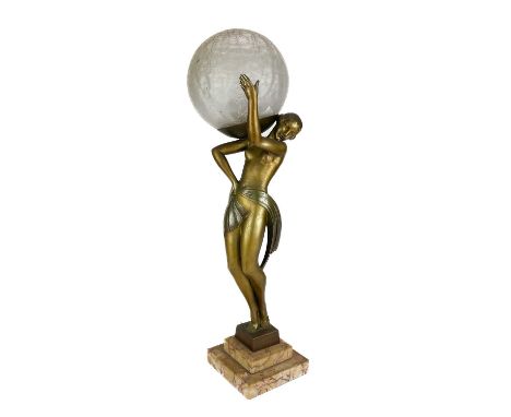 An Art Deco patinated spelter figural table lamp after Faguays by Fayral. On a stepped marble base, signed with a crizzle sph