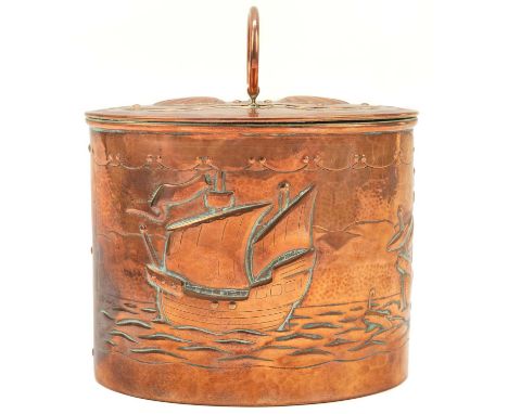 A Newlyn copper oval tea caddy. The pull off cover with loop handle and two shells, the main body repousse decorated with thr