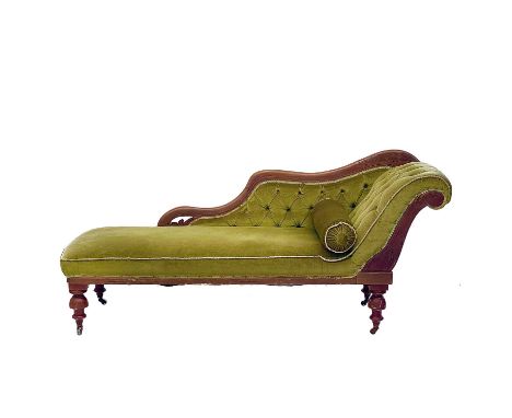 A late Victorian beech frame chaise longue. With button back upholstery on turned supports and brass castor wheels, height 84