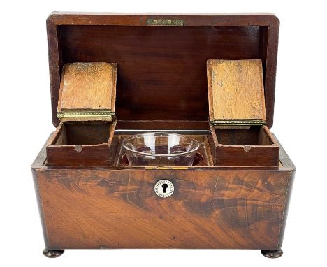 A Victorian mahogany tea caddy. With a domed top and two internal lidded compartments, on disc feet, width 30cm.