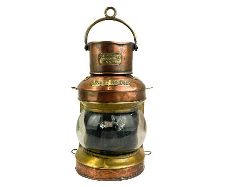 A ship's copper mast head lamp. By Pascall Atkey &amp; Son, Manufacturers, Cowes, with oil burner, height to top of handle 40