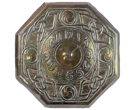 An Arts and Crafts repousse decorated brass faced wall clock. With Arabic numerals and broad Celtic knot designed border, the