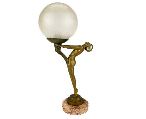 An Art Deco patinated spelter figural table lamp. Signed Le Verrier Paris France to the stepped base on a red marble circular