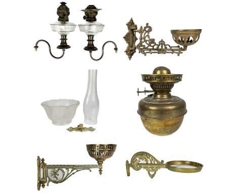 A Victorian wall mounted brass oil lamp. With moulded glass shade, length 35cm, together with a pair of peg oil lamps with gl