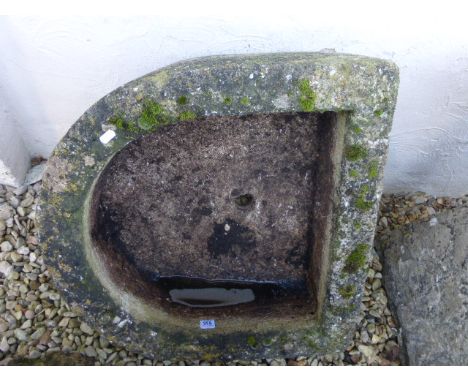 A reconstituted stone D-shaped trough