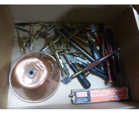 A collection of tools including glasscutters
