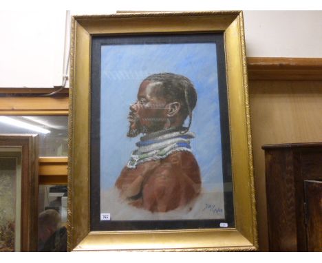 Gilt framed pastel portrait of an African tribesman signed