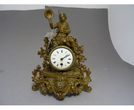 Contintental Gilt Metal Ornate Mantle Clock surmounted with a Seated Bow holding Hat