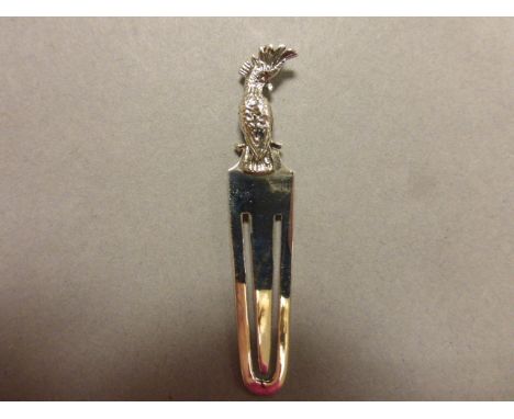 A silver bookmark with parrot finial