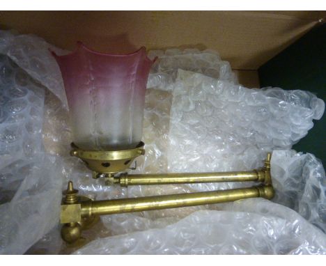 An early 20th century brass gas wall light, with pink glass shade