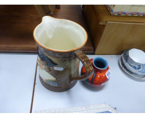 A Falcon Ware jug, decorated with a cavalier, model number 1801, along with Poole pottery vase