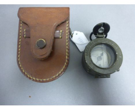 An American Lensatic Compass, in a fitted leather case  