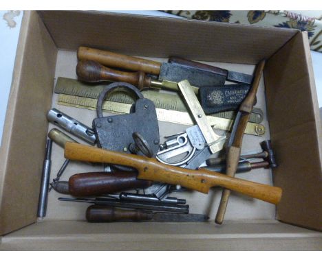 A collection of vintage tools and other items including an iron padlock